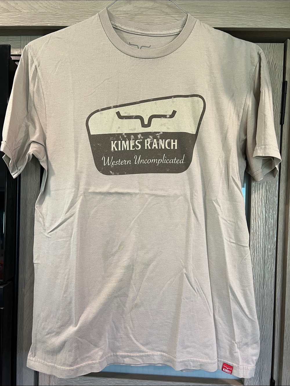 Kimes Ranch Cream Tee with Brown Western Logo